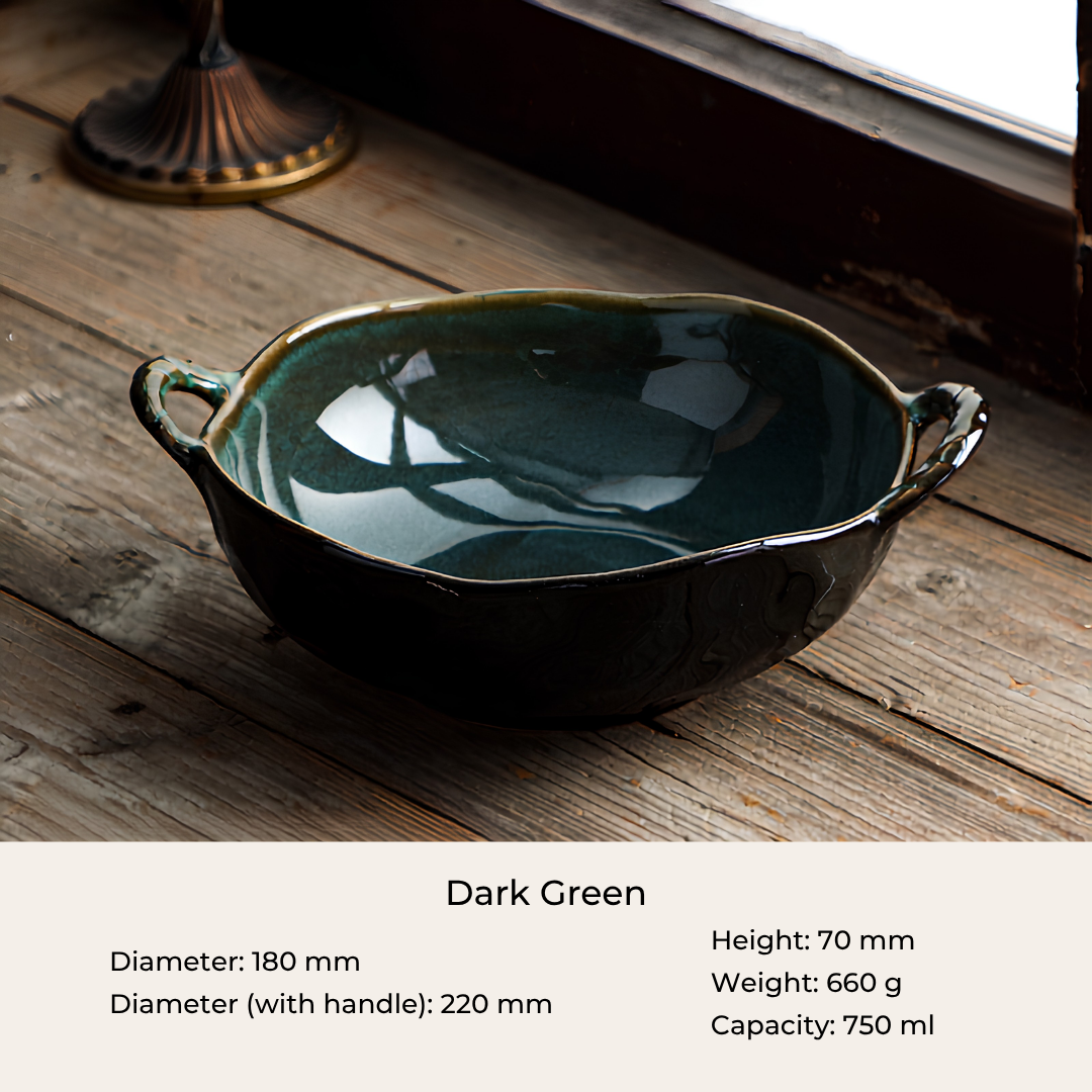 A glossy ceramic bowl in a deep emerald green glaze, shown on a rustic wooden surface with a text overlay at the bottom detailing its dimensions, weight, and capacity.