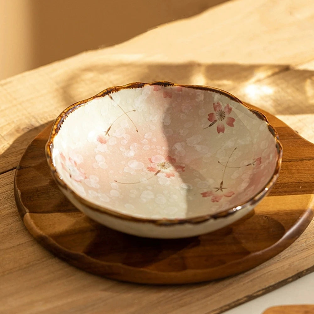 Ceramic bowl with floral design on a wooden surface